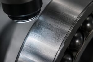 Close-up inspection of bearing raceway surface finish under magnification